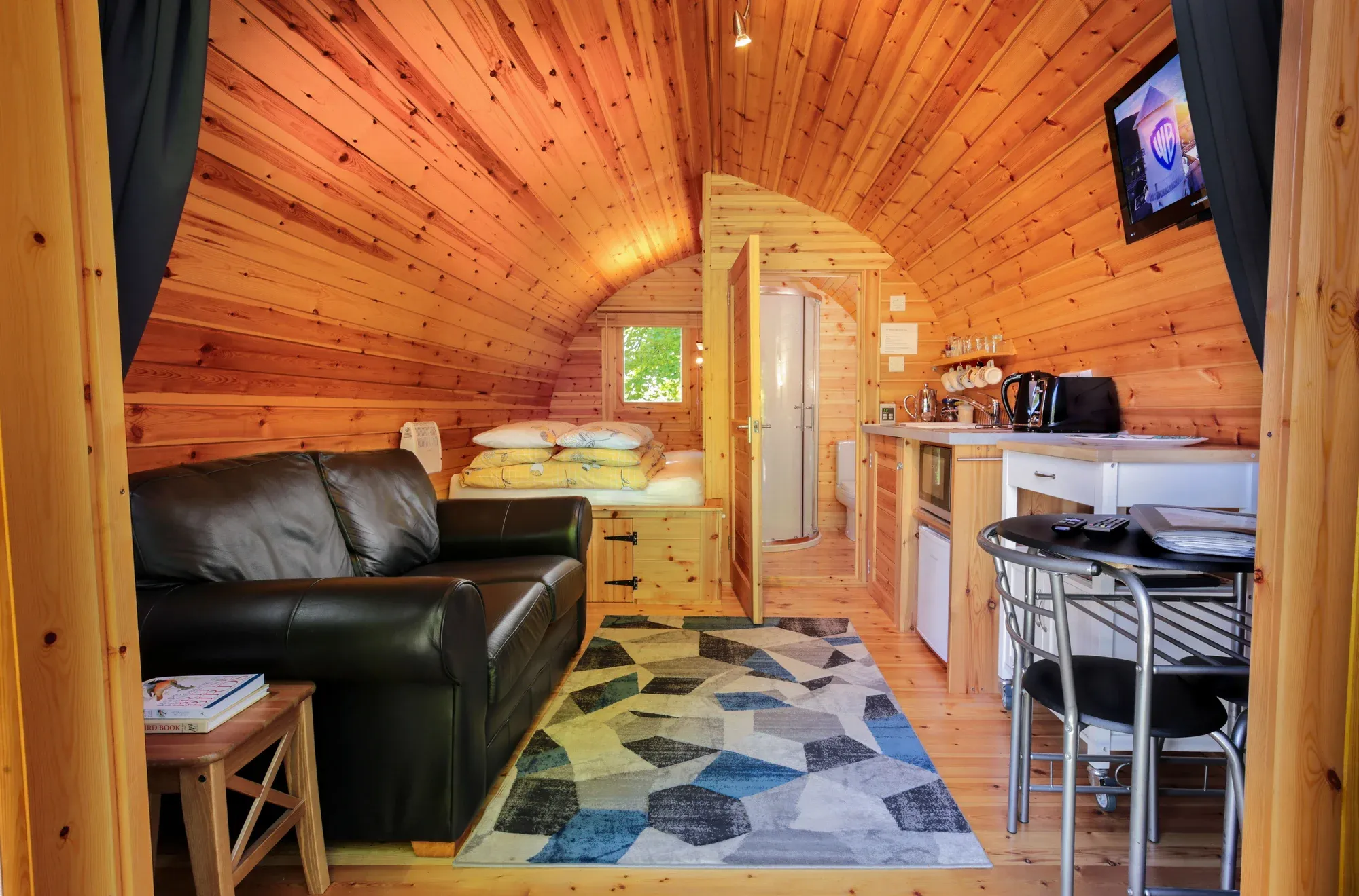 Cosy Coorie Pod interior — double bed and living area