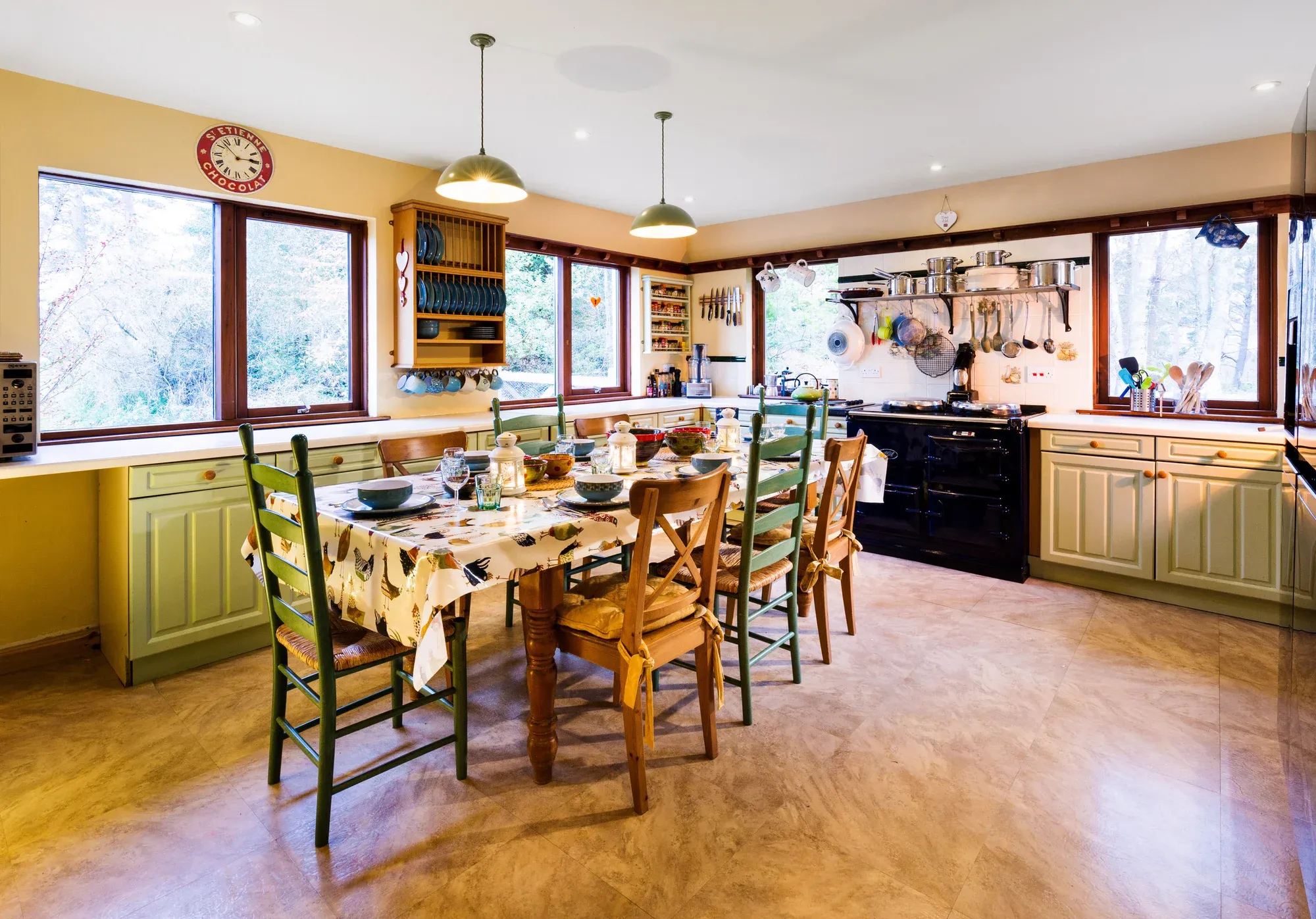 The kitchen at WEE WiLDS — Aga range cooker, warm wood, morning light